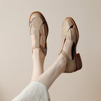 ZOFIA ATELIER Adrianne retro flat sandals in creamy-white cowhide with round toe and buckle strap.