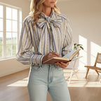 ZOFIA ATELIER ADRIANNA blouse with blue and beige stripes, bow tie neck, and long sleeves. Polyester fabric.