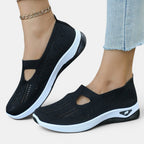 ZOFIA ATELIER AGATA black knit slip-on sneakers with white soles and a cutout detail.