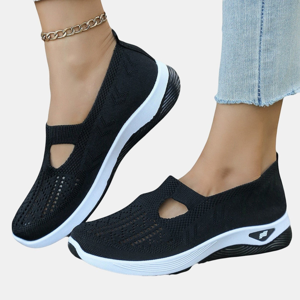 ZOFIA ATELIER AGATA black knit slip-on sneakers with white soles and a cutout detail.