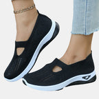 ZOFIA ATELIER AGATA black knit slip-on sneakers with white soles and a cutout detail.