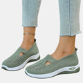 ZOFIA ATELIER AGATA olive green knit slip-on sneakers with cushioned sole and cutout detail.