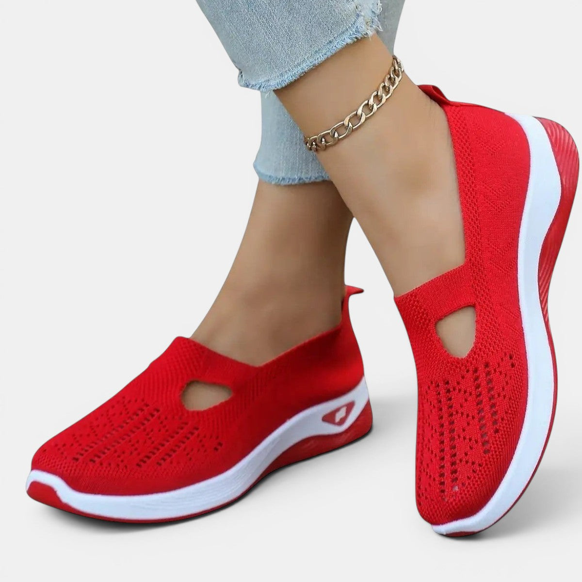 ZOFIA ATELIER AGATA red knit slip-on sneakers with white soles and decorative cut-out detail.