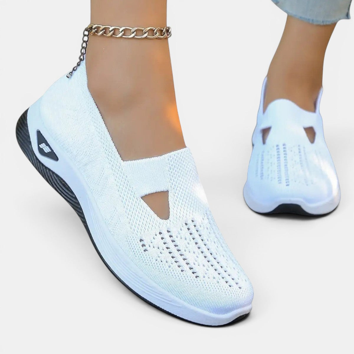ZOFIA ATELIER AGATA white knit slip-on sneakers with a cushioned sole and decorative cutout detail.