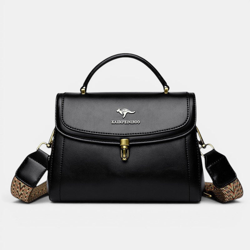 ZOFIA ATELIER Agnieszka black PU textured crossbody handbag with gold hardware and patterned strap.