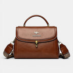 ZOFIA ATELIER Agnieszka textured brown PU leather crossbody handbag with gold hardware and patterned strap.