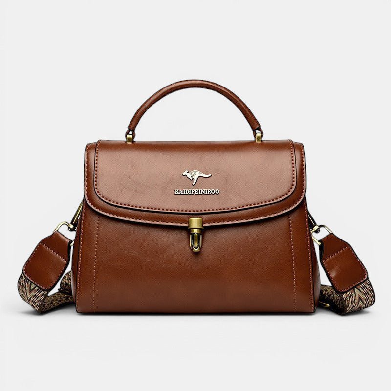 ZOFIA ATELIER Agnieszka textured brown PU leather crossbody handbag with gold hardware and patterned strap.