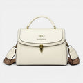 ZOFIA ATELIER Agnieszka white PU leather crossbody handbag with textured strap and gold clasp.