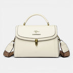 ZOFIA ATELIER Agnieszka white PU leather crossbody handbag with textured strap and gold clasp.