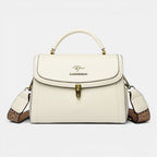 ZOFIA ATELIER Agnieszka white PU leather crossbody handbag with textured strap and gold hardware.