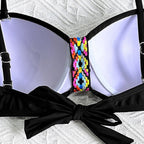 ZOFIA ATELIER Alina split detail bikini set in black with colorful woven accent and black bow tie detail.