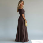 ZOFIA ATELIER ANDREA off-shoulder maxi dress in dark brown stretch polyester with a high waist and flowing skirt.