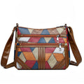 ZOFIA ATELIER ANIA multi-layer crossbody bag in brown PU leather with colorful patchwork design and silver zippers.