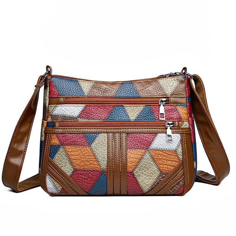 ZOFIA ATELIER ANIA multi-layer crossbody bag in brown PU leather with colorful patchwork design and silver zippers.