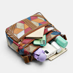 ZOFIA ATELIER ANIA multi-layer crossbody bag in patchwork leather with brown trim. Features multiple compartments and a single shoulder strap.