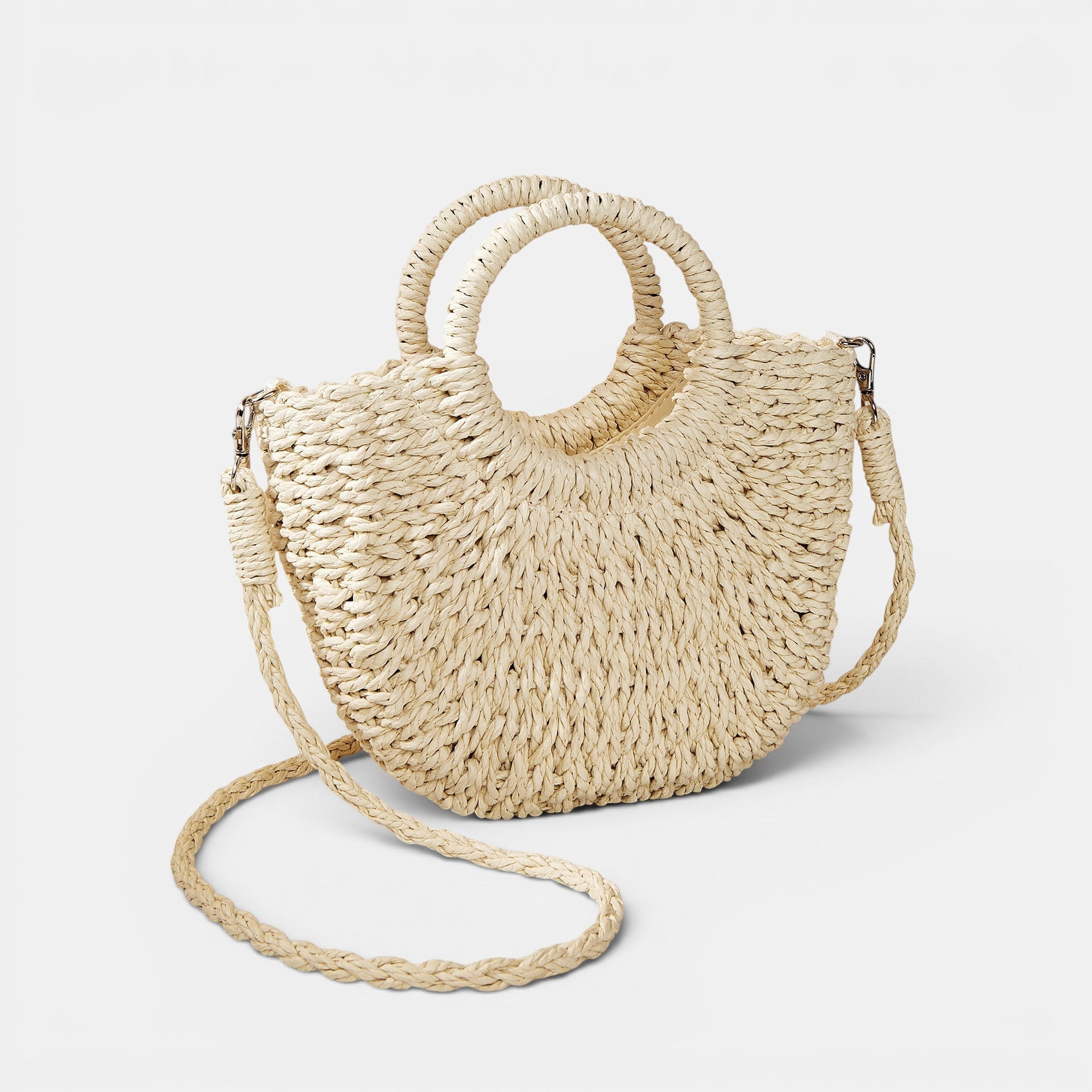 ZOFIA ATELIER ANNA crossbody bag made of woven paper in a natural beige color with round top handles and a long braided strap.