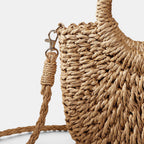ZOFIA ATELIER ANNA crossbody bag made of woven paper in a natural camel color with a peach skin lining and braided strap.