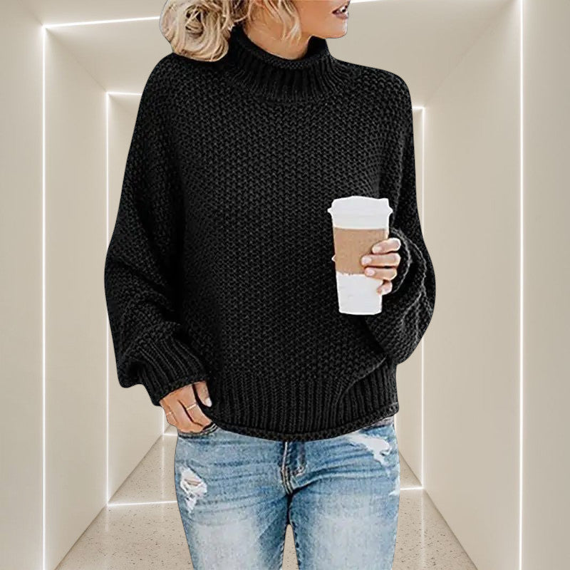 ZOFIA ATELIER ANNA black chunky knit turtleneck sweater with relaxed fit and long sleeves.