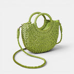ZOFIA ATELIER ANNA green woven paper crossbody bag with double handles and peach skin lining.