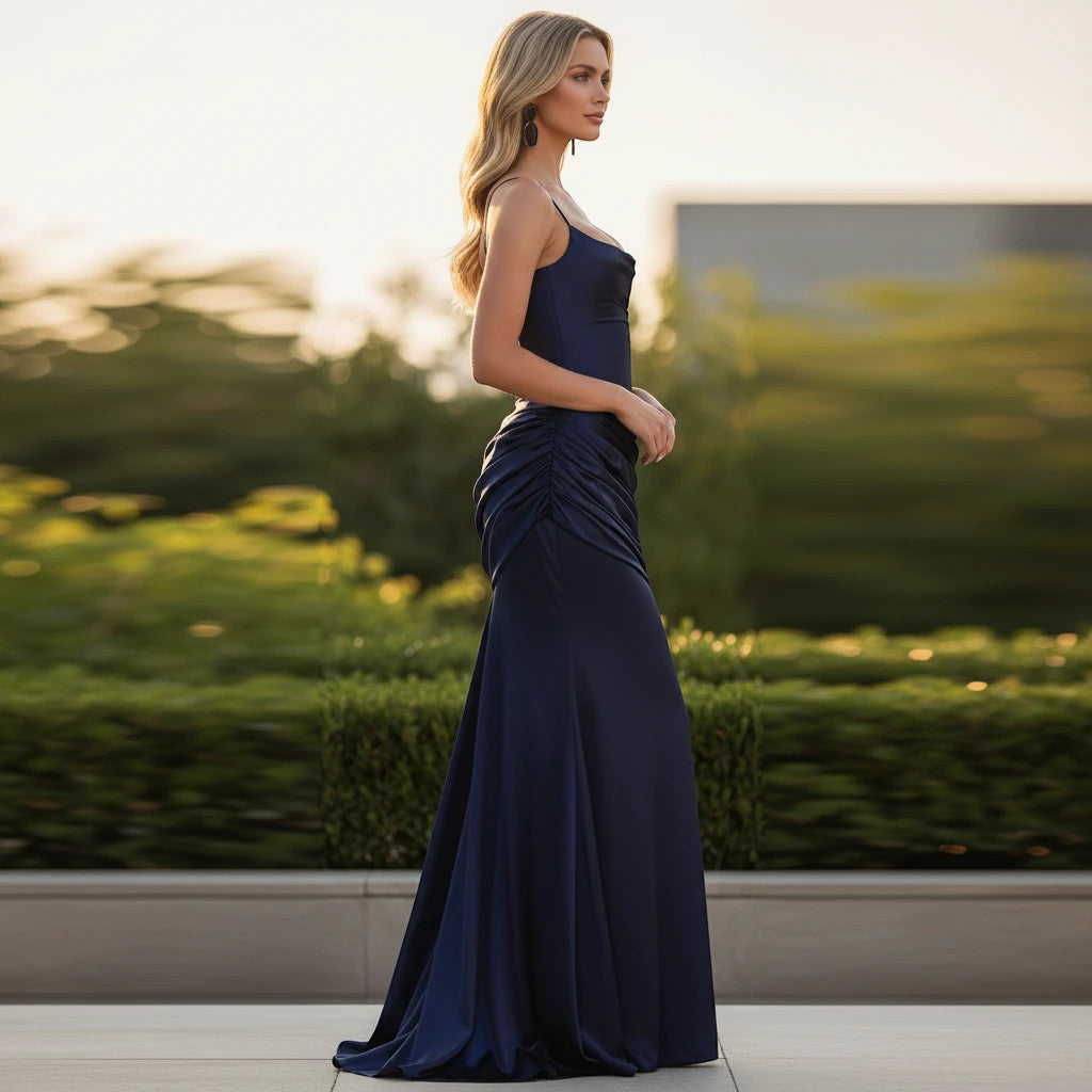ZOFIA ATELIER ANNA navy blue floor-length slip dress with spaghetti straps and ruched detailing.