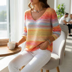 ZOFIA ATELIER women's V-neck long sleeve top with a colorful striped art print in orange, yellow, pink, and blue hues.
