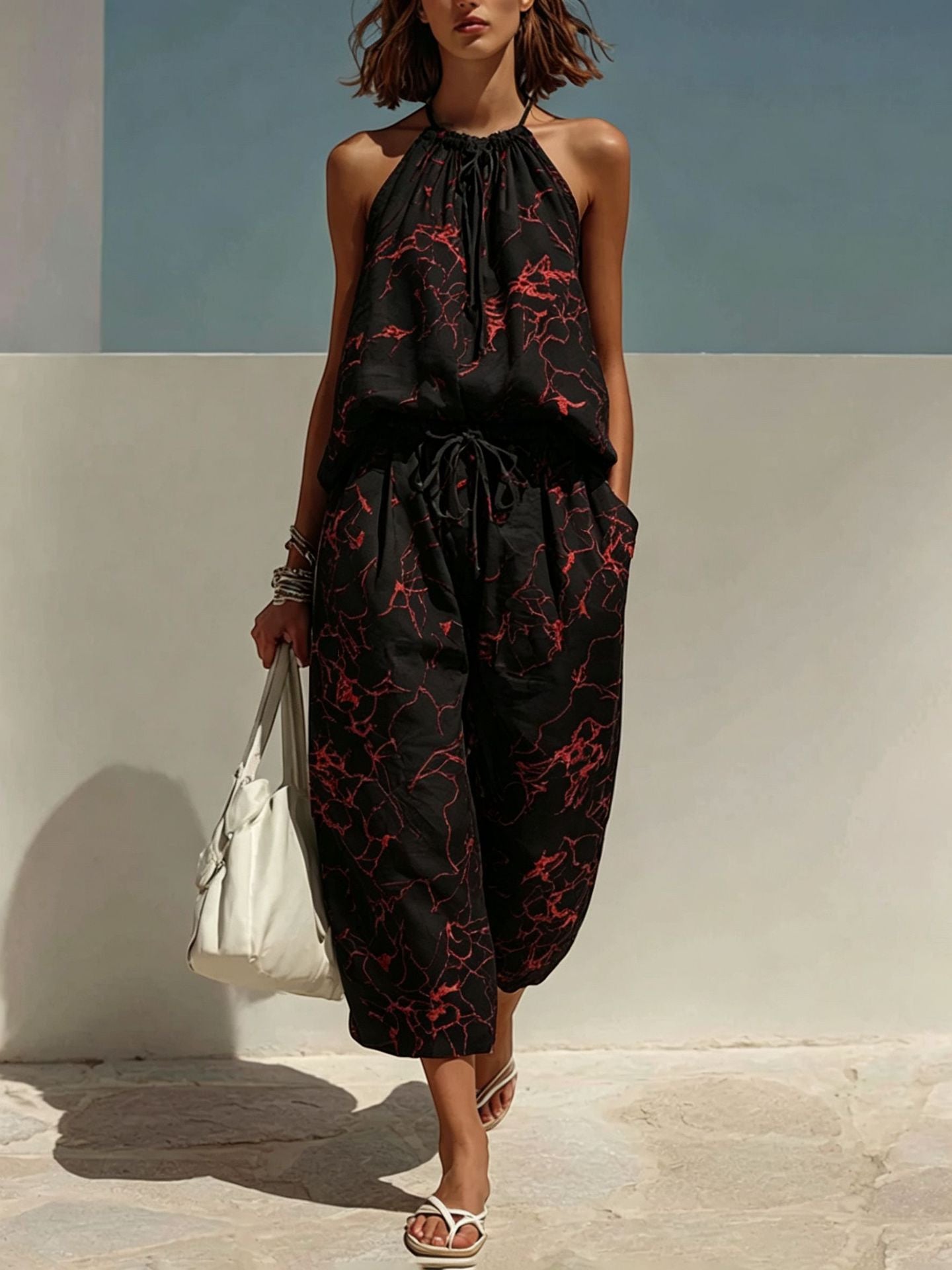 ZOFIA ATELIER black linen blend camisole set with red abstract print, backless halter top and wide-leg cropped pants.
