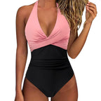 ZOFIA ATELIER pink and black colorblock halter neck one-piece swimsuit with ruched waist and backless design.