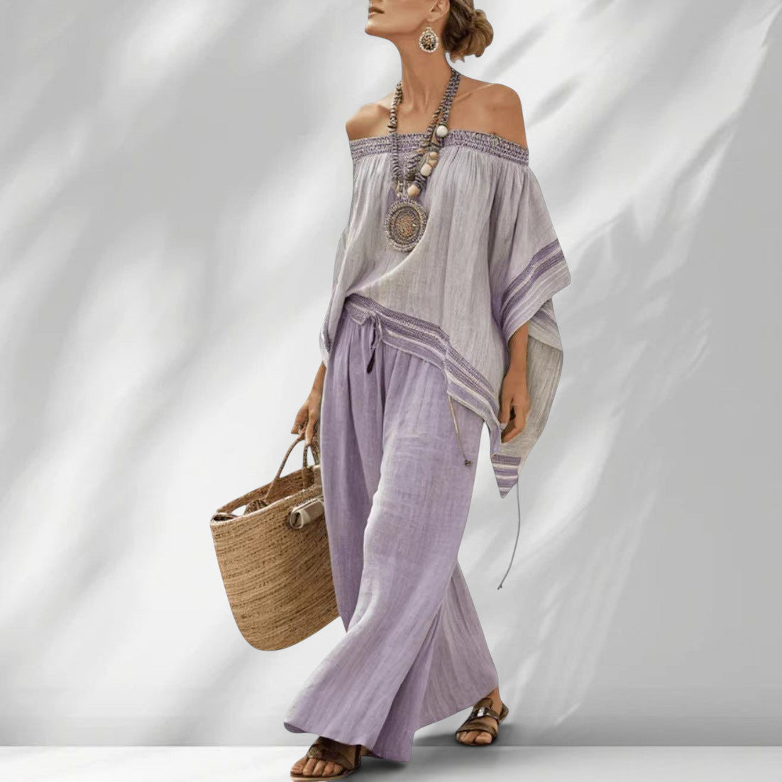 ZOFIA ATELIER BARBARA: Light grey off-shoulder top with purple trim and lavender wide-leg pants. Beach lounge set.