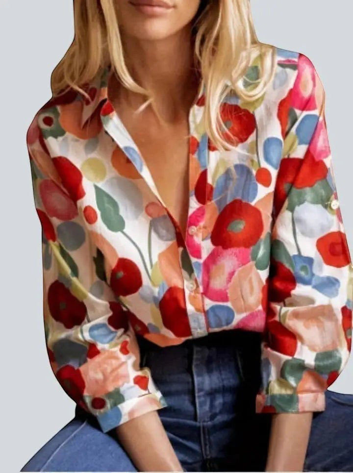 ZOFIA ATELIER BEATA floral long sleeve blouse with notched collar and fluid drape. Features red, pink, blue, and orange floral print on white fabric.
