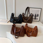 ZOFIA ATELIER BEATA leisure tote bag in black and brown PU leather, dumpling shape, single strap, retro style.