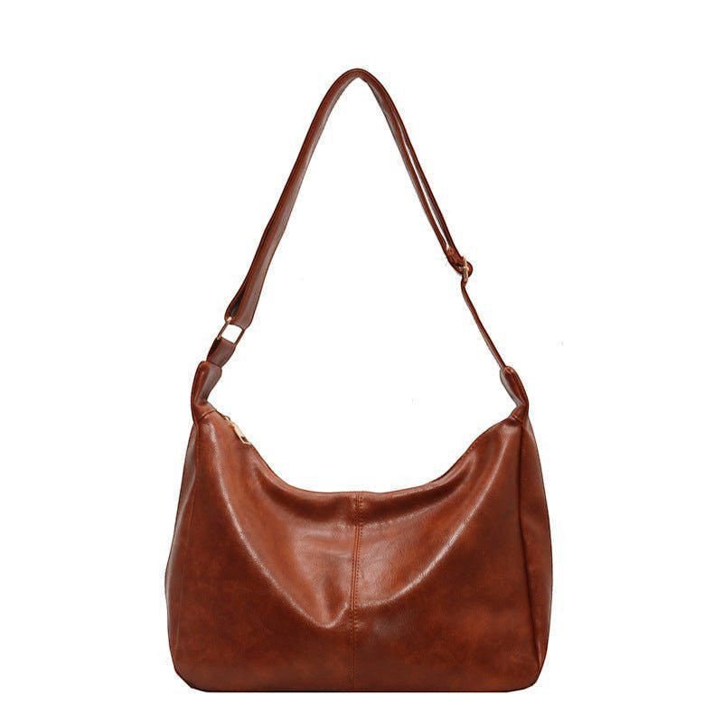 ZOFIA ATELIER BEATA leisure tote bag in brown PU leather with dumpling shape and single strap.