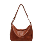 ZOFIA ATELIER BEATA leisure tote bag in brown PU leather with dumpling shape and single strap.