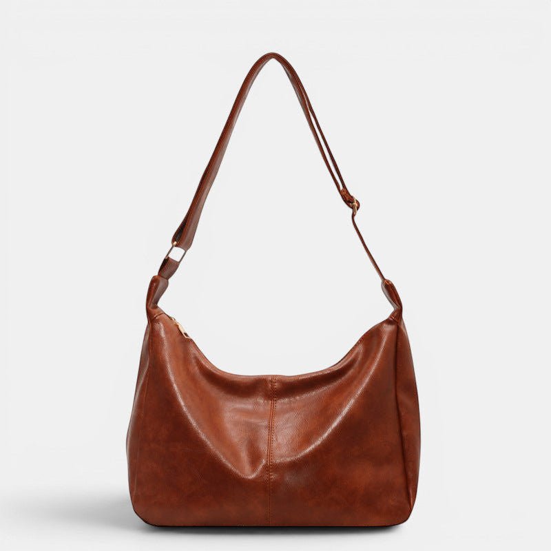 ZOFIA ATELIER BEATA leisure tote bag in brown PU leather with a dumpling shape and single strap.