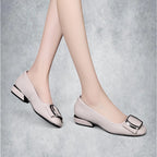ZOFIA ATELIER beige square-toe PU leather slip-on shoes with decorative buckle and block heel.