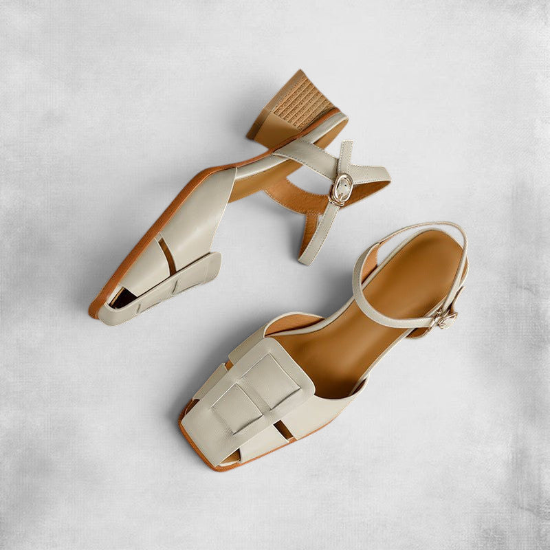ZOFIA ATELIER beige leather square toe mid-heel sandals with ankle strap and buckle detail.