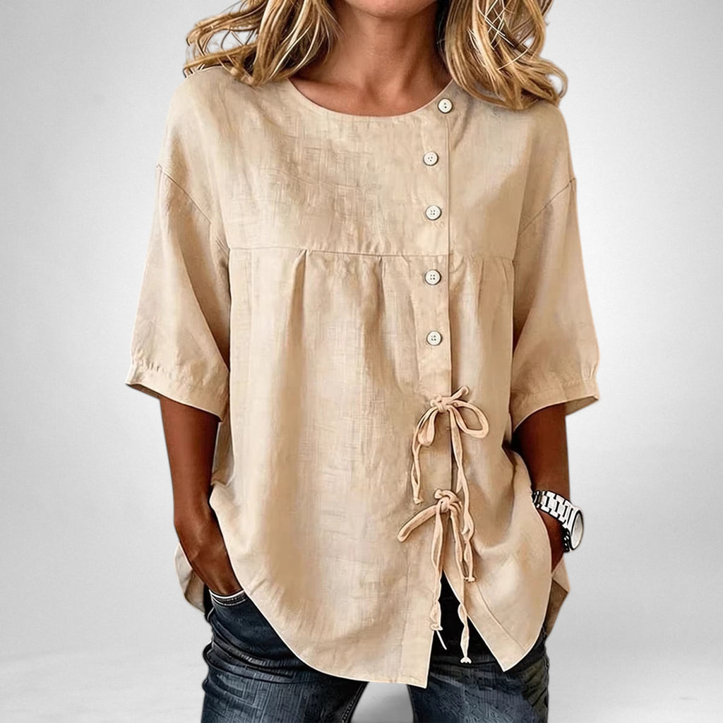 ZOFIA ATELIER beige linen asymmetric lace-up shirt with princess sleeves and button closure.
