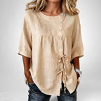 ZOFIA ATELIER beige linen asymmetric lace-up shirt with princess sleeves and button closure.