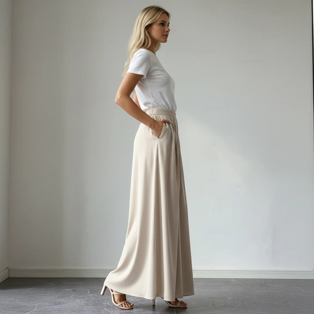 ZOFIA ATELIER beige polyester wide-leg bohemian pants with semi-elastic high-waist and pockets.