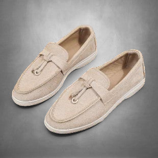 ZOFIA ATELIER beige suede loafers with tassel detail and flat sole. Comfortable slip-on style for everyday wear.