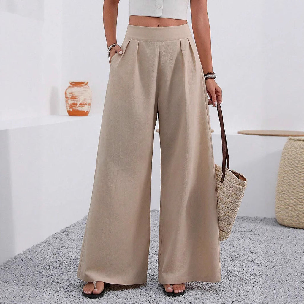 ZOFIA ATELIER high-waisted, wide-leg trousers in beige polyester with pockets and a full-length design.