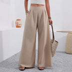 ZOFIA ATELIER high-waisted, wide-leg trousers in beige polyester with pockets and a full-length design.