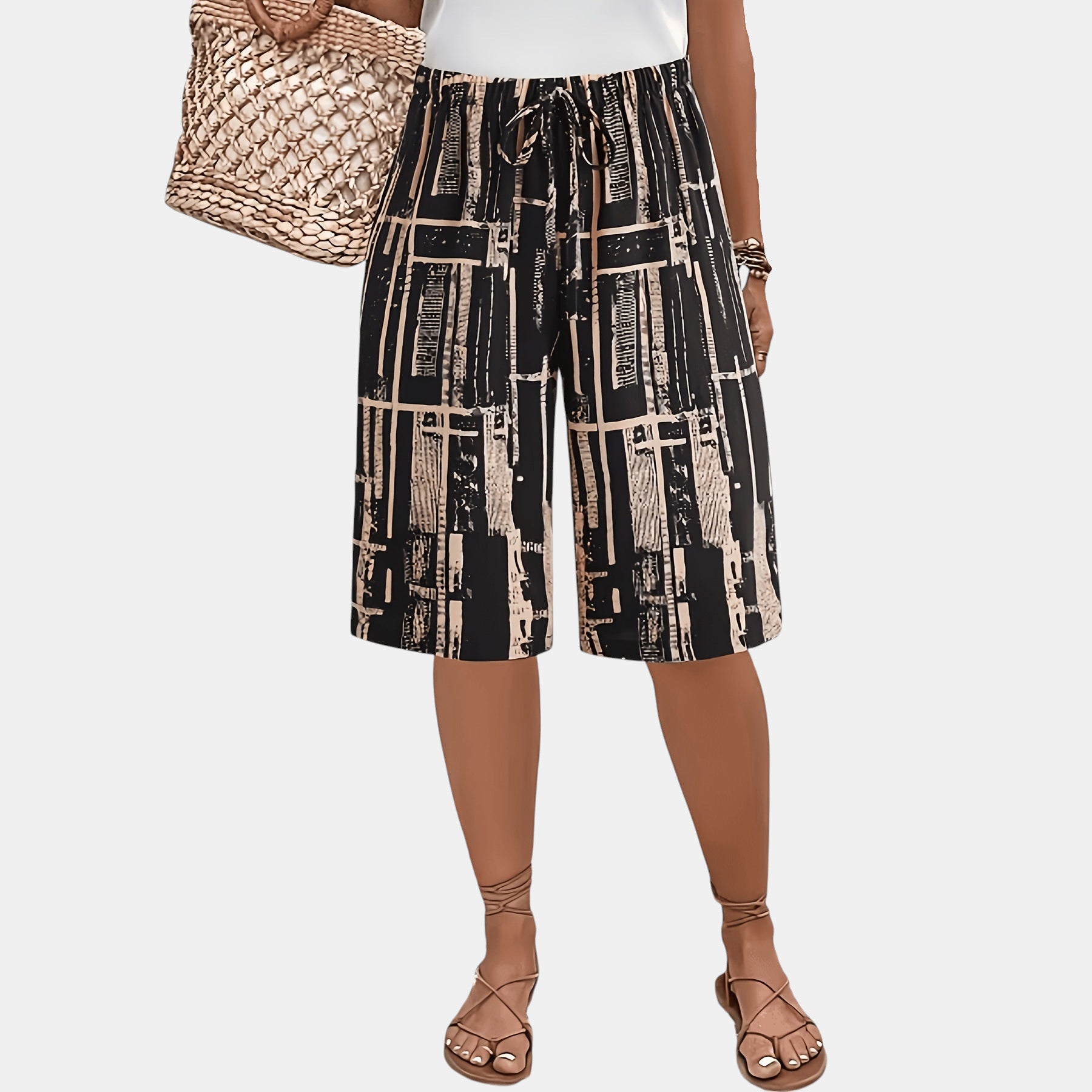 ZOFIA ATELIER black and beige abstract print capri pants with loose fit and drawstring waist.