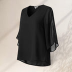 ZOFIA ATELIER black chiffon v-neck blouse with flutter sleeves and a hi-low hem.