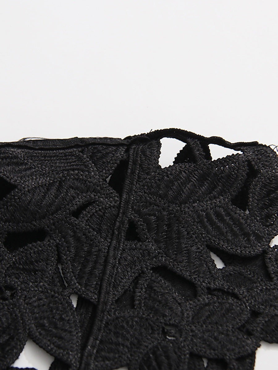 ZOFIA ATELIER black floral lace crop top with round neckline and short sleeves, featuring an openwork design.