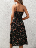 ZOFIA ATELIER black polyester midi dress with a red and white floral print and adjustable spaghetti straps.