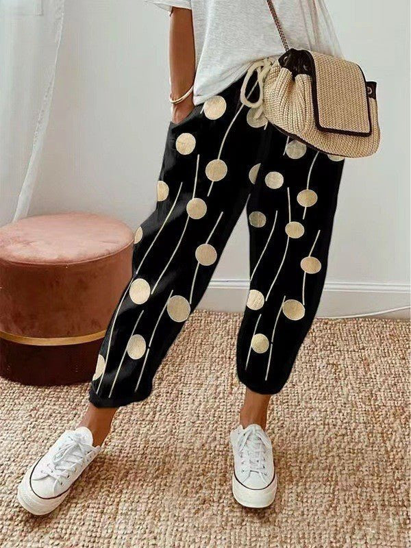 ZOFIA ATELIER black cropped pants with gold polka dots and white stripes, loose fit, cotton-linen blend.