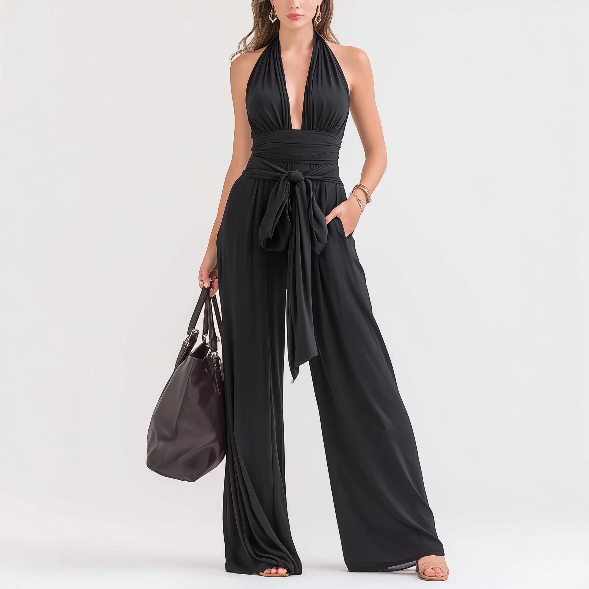 ZOFIA ATELIER black polyester halter-neck sleeveless wide-leg jumpsuit with tie waist and pockets.