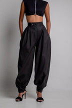 ZOFIA ATELIER black high waist loose polyester jeans with ankle ties and zipper fly.