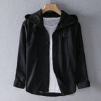 ZOFIA ATELIER DANUTA black hooded blouse with white t-shirt underneath, long sleeves, button-up front, and relaxed fit.