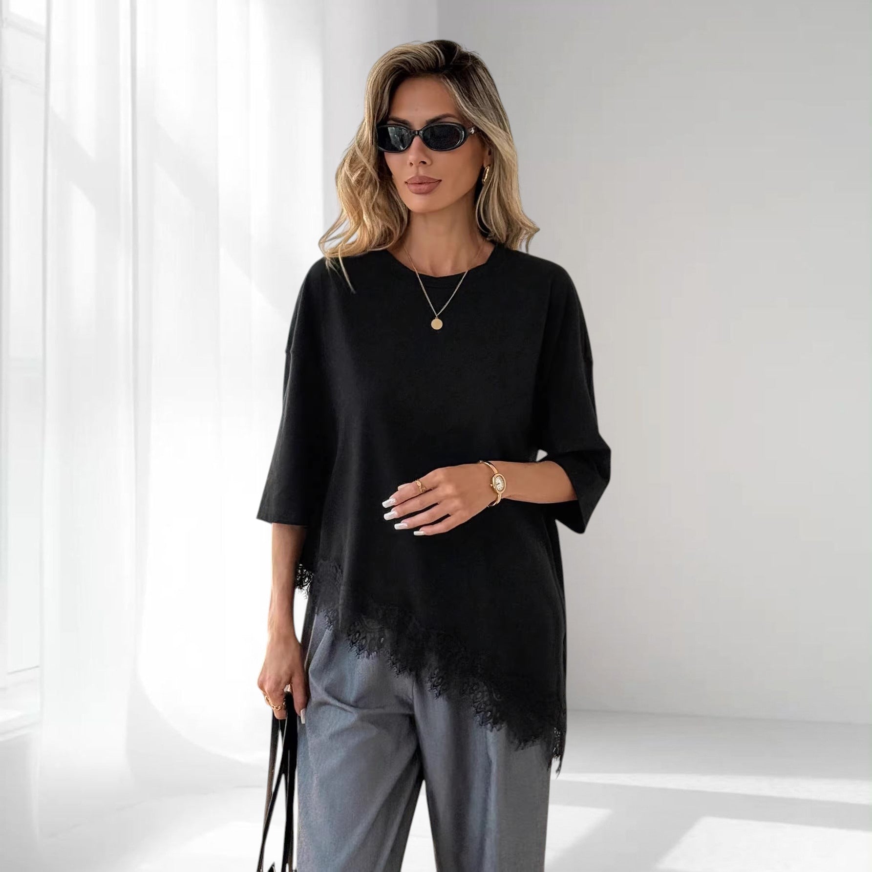 ZOFIA ATELIER black cotton loose fit top with delicate lace-panel hem and short sleeves.